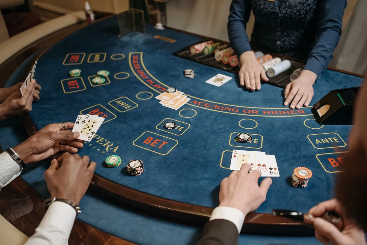 Guests playing cards at a poker table