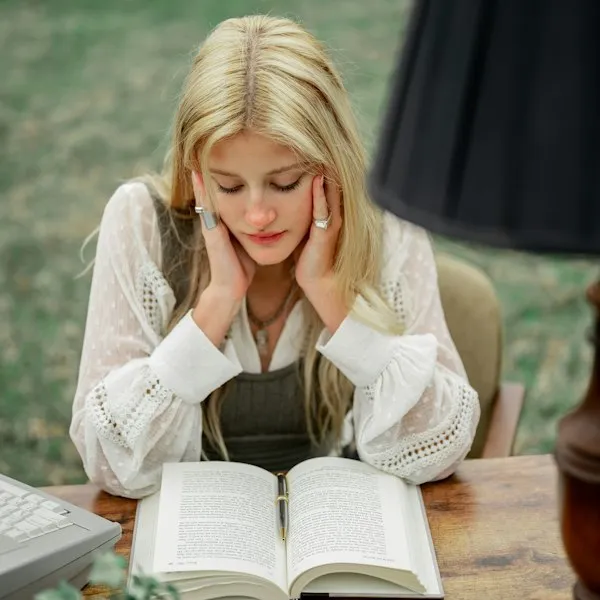 Woman reading at a table